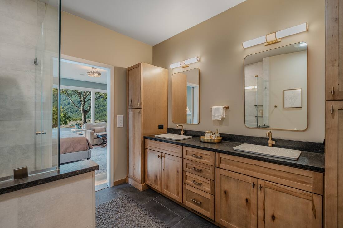 Primary bath with dual vanities and frameless glass shower